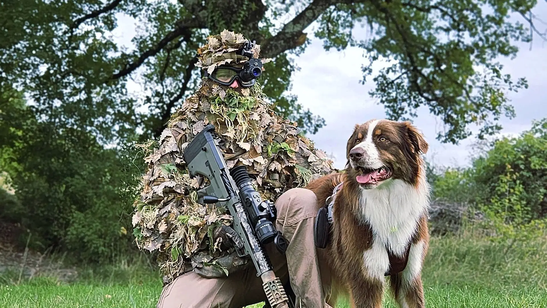 a man playing outdoor tactical game with binock nvg50 night vision monocular with his dog